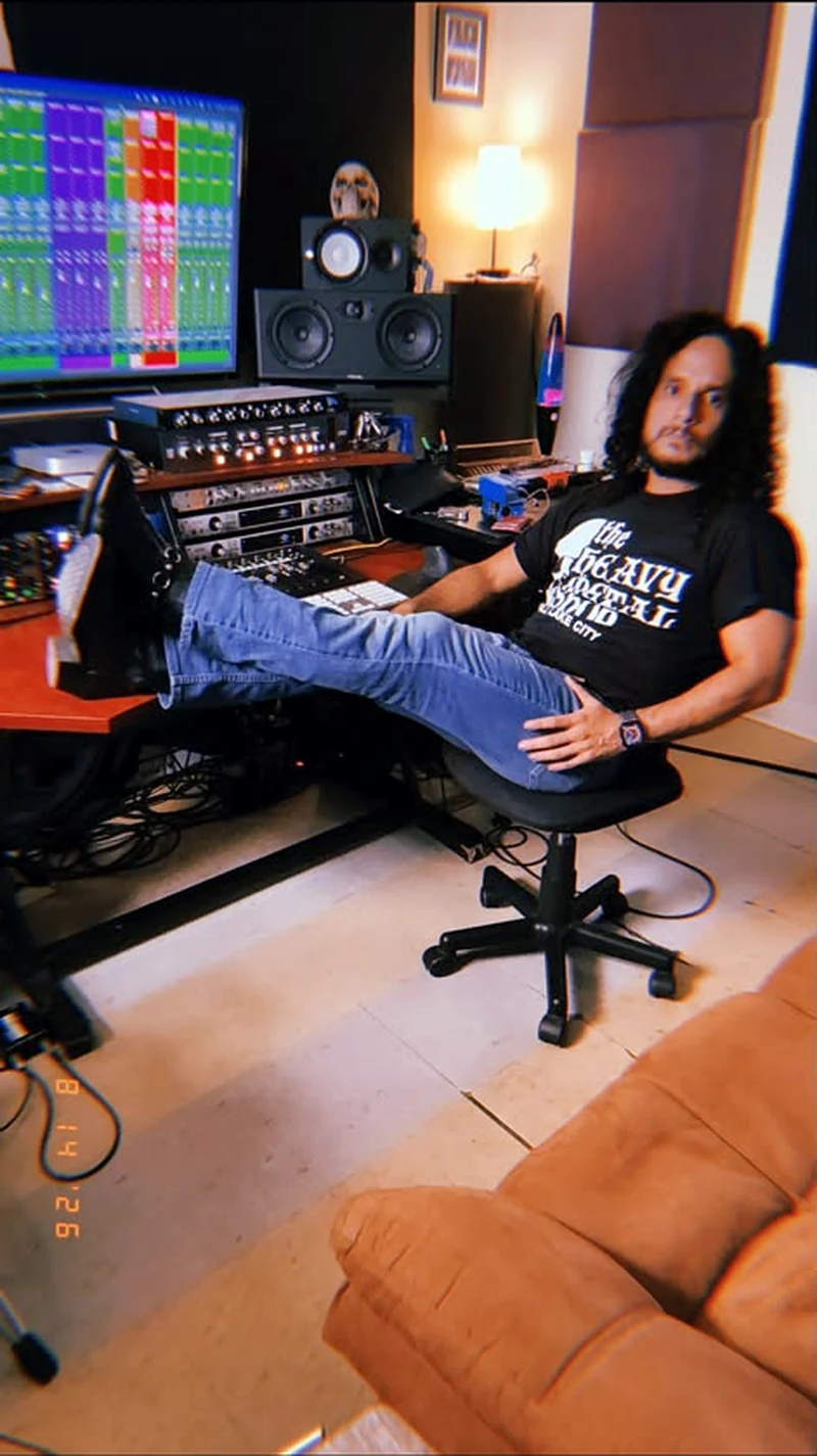 Yave Rodriguez seated in his recording studio